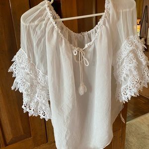 Sheer white blouse. Lace sleeves.